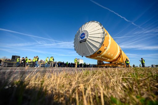 NASA Moves First Artemis SLS Rocket Stage from NASA’s Factory to Barge