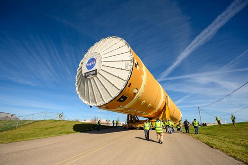 NASA Moves First Artemis SLS Rocket Stage from NASA’s Factory to Barge