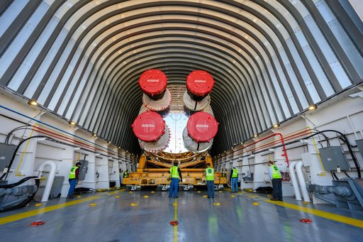 NASA Moves First Artemis SLS Rocket Stage from NASA’s Factory to Barge