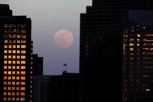 Nearly full moon rises over New Orleans