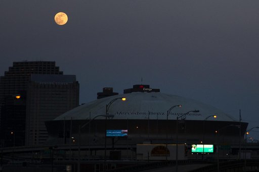 Nearly full moon rises over New Orleans