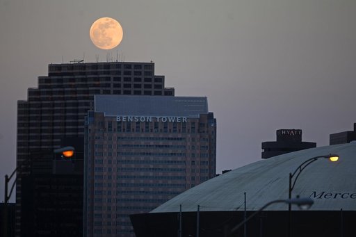 Nearly full moon rises over New Orleans