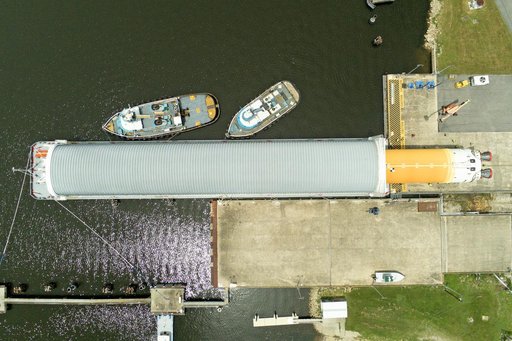 Space Launch System Core Stage for Artemis II Rocket Loaded onto Pegasus Barge