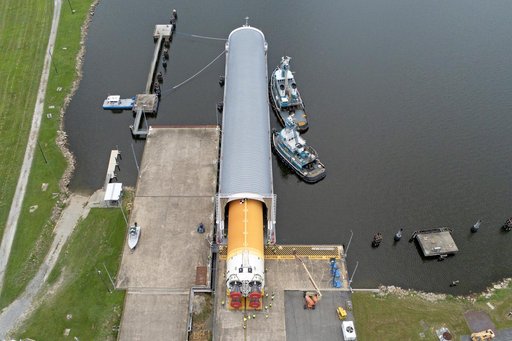 Space Launch System Core Stage for Artemis II Rocket Loaded onto Pegasus Barge