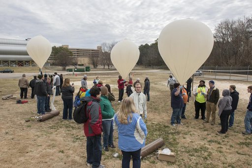 Community college students conducting experiment