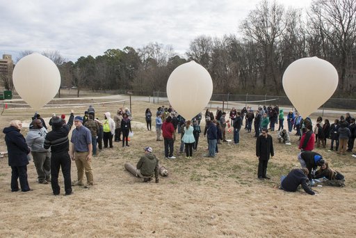 Community college students conducting experiment