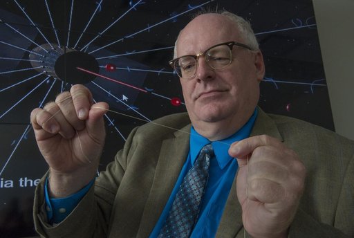 Bruce Wiegman with a tether for the Electostatic Propulsion System.