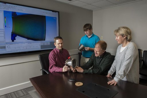 Engineers with nozzles fabricated using a freeform-directed ener