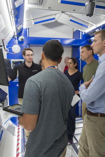 Boeing trainers conduct simulations inside the Boeing Exploratio