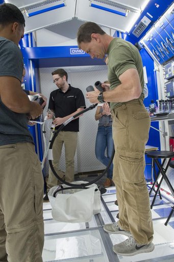 Boeing trainers conduct simulations inside the Boeing Exploratio