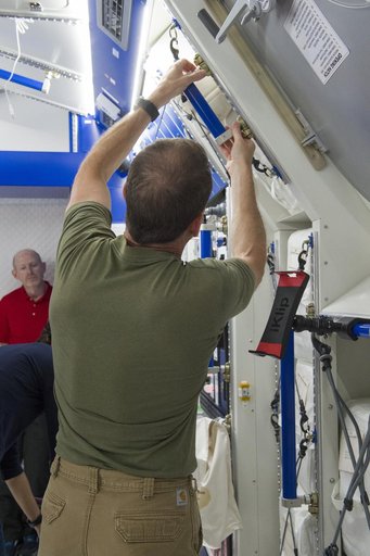 Boeing trainers conduct simulations inside the Boeing Exploratio