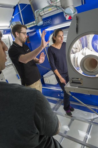 Boeing trainers conduct simulations inside the Boeing Exploratio