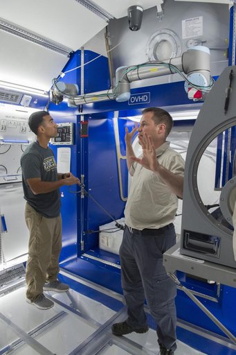 Boeing trainers conduct simulations inside the Boeing Exploratio