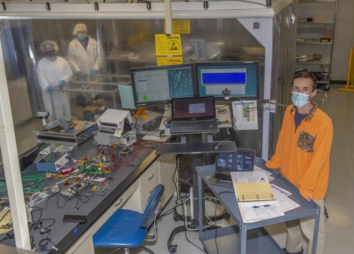 Spacecraft in Gravity Off-load Fixture (GOLF), System Test configuration - Arisa Waddle – Test Engineer,  Rick Wilson – Lead Test Engineer