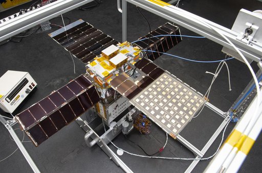 Spacecraft in Gravity Off-load Fixture (GOLF), System Test configuration - Arisa Waddle – Test Engineer,  Rick Wilson – Lead Test Engineer