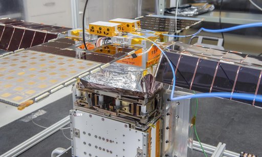 Spacecraft in Gravity Off-load Fixture (GOLF), System Test configuration - Arisa Waddle – Test Engineer,  Rick Wilson – Lead Test Engineer