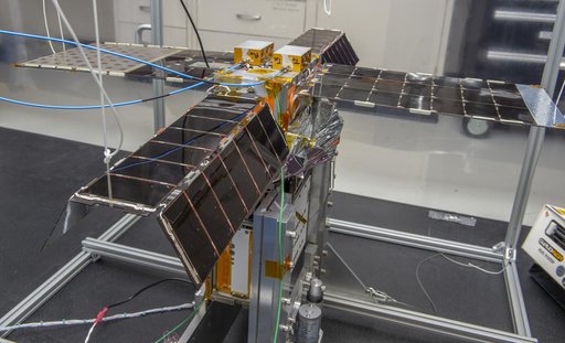 Spacecraft in Gravity Off-load Fixture (GOLF), System Test configuration - Arisa Waddle – Test Engineer,  Rick Wilson – Lead Test Engineer