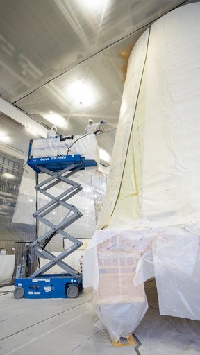 Technicians Apply Thermal Protection Material to NASA Moon Rocket Hardware