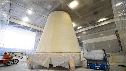 Technicians Apply Thermal Protection Material to NASA Moon Rocket Hardware