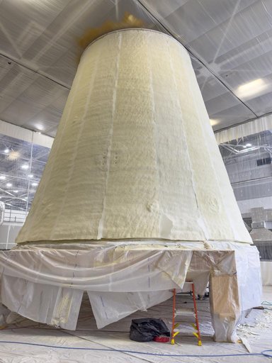 Technicians Apply Thermal Protection Material to NASA Moon Rocket Hardware