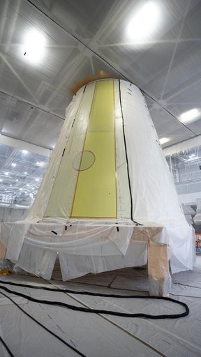 Technicians Apply Thermal Protection Material to NASA Moon Rocket Hardware