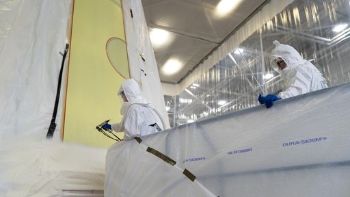 Technicians Apply Thermal Protection Material to NASA Moon Rocket Hardware