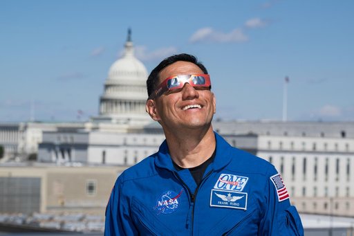 Expedition 69 Crew Wears Solar Eclipse Glasses