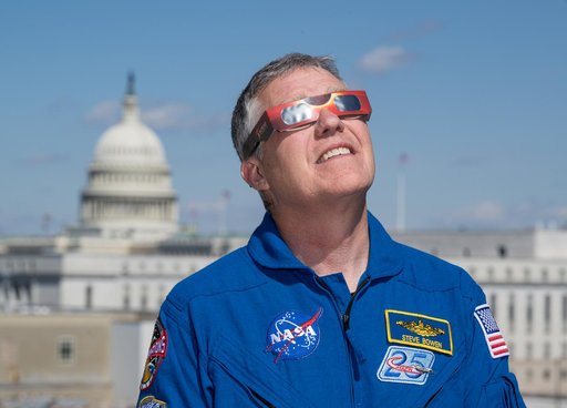 Expedition 69 Crew Wears Solar Eclipse Glasses
