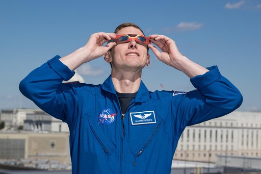 Expedition 69 Crew Wears Solar Eclipse Glasses