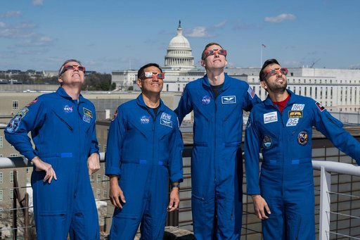 Expedition 69 Crew Wears Solar Eclipse Glasses