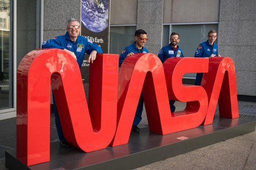 Expedition 69 Crew Wears Solar Eclipse Glasses