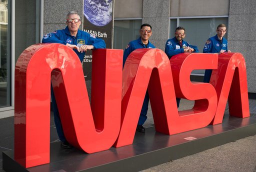 Expedition 69 Crew Wears Solar Eclipse Glasses