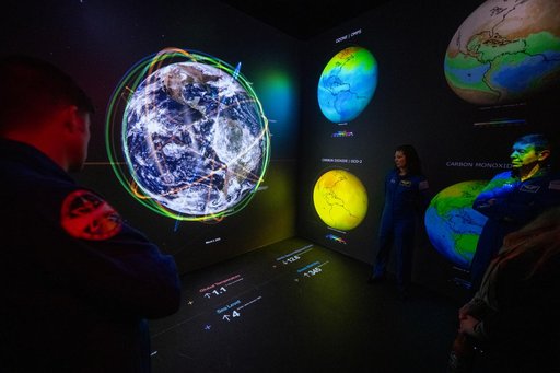 Expedition 71 Astronauts Visit Earth Information Center