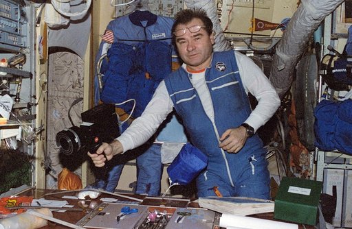 Strekalov in Mir Core module with microbial air sampler