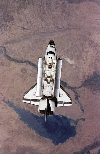 Space shuttle Atlantis preparing to dock with Mir space station