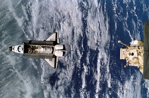 Space shuttle Atlantis preparing to dock with Mir space station