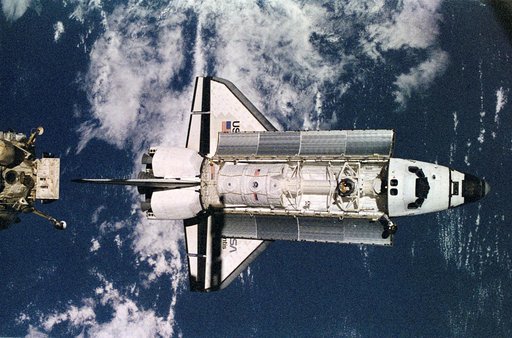 Space shuttle Atlantis preparing to dock with Mir space station