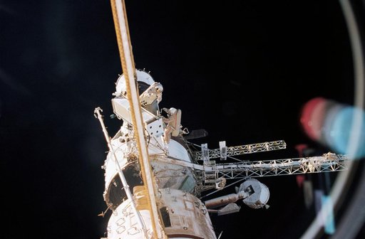View of Mir 21 cosmonauts during EVA to move solar array