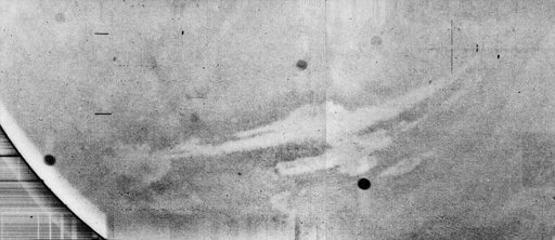 Mariner 9 views Canyon System emerging from Martian Dust Storm