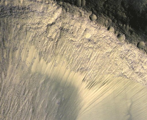 Seasonal Changes in Dark Marks on an Equatorial Martian Slope