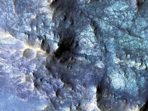 Exposed Fractured Bedrock in the Central Pit of a Crater
