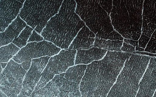 Cracks in a Crater Ice