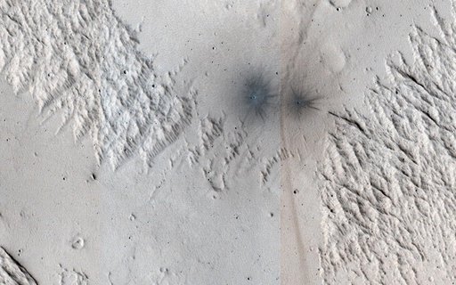 A Criss-Cross Landscape with Fresh Craters
