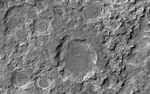 Dark Patches Formed by Craters