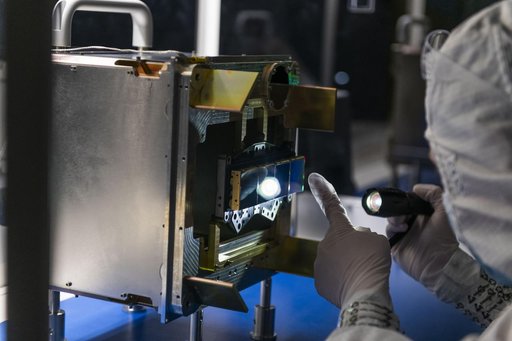 An engineer inspects NEO Surveyor’s Infrared Detectors