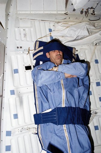 Mission Specialist (MS) Fabian in middeck sleep restraint