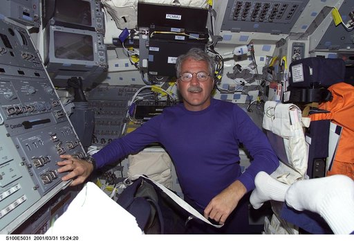MS Phillips poses on the aft flight deck of Endeavour