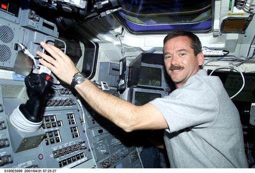 MS Hadfield works at the RMS Translation Hand Controller on the aft flight deck of Endeavour