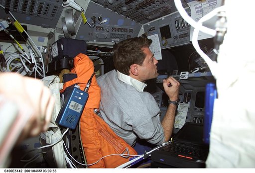 Pilot Ashby works at the commander's workstation on the flight deck of Endeavour