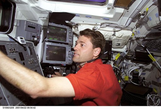 Pilot Ashby works at the aft crew workstation on the flight deck of Endeavour